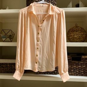 Peach button down blouse with peek a boo back!